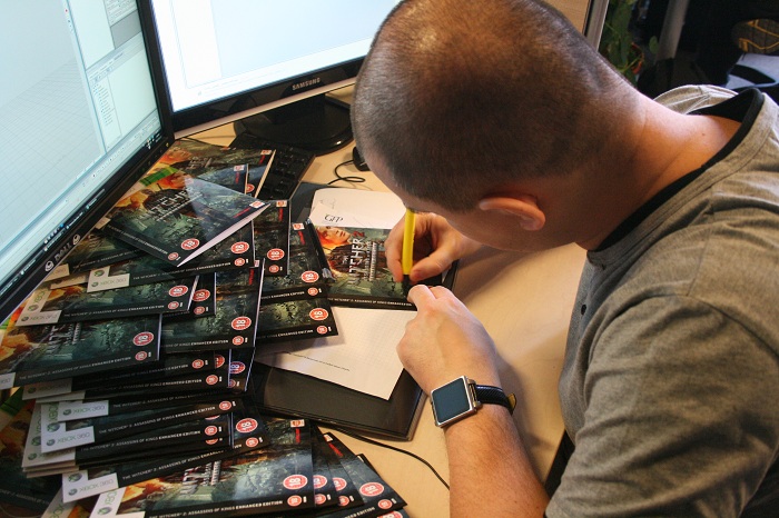 CD_Projekt_Red_Team_Signing_Xbox_Game_Boxes.jpg